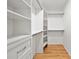 Organized walk-in closet with shelving and drawers, offering ample storage space at 4639 Cabbage Palm Dr, Valrico, FL 33596