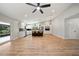 Open concept living area with barstool seating at the island and access to the backyard at 4639 Cabbage Palm Dr, Valrico, FL 33596