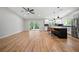Spacious living area with an open floorplan, featuring a modern kitchen and access to a patio at 4639 Cabbage Palm Dr, Valrico, FL 33596