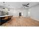 Bright living room with an open floorplan, featuring a kitchen island with barstool seating at 4639 Cabbage Palm Dr, Valrico, FL 33596
