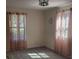 Bright bedroom with two windows, neutral carpet, and natural light at 5017 E 127Th Ave, Temple Terrace, FL 33617