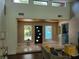 Open and bright foyer with high ceilings, modern lighting, and a view to the exterior at 5017 E 127Th Ave, Temple Terrace, FL 33617