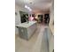 Modern kitchen with a spacious island, stone countertops, and stainless steel appliances at 5017 E 127Th Ave, Temple Terrace, FL 33617