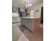 Contemporary kitchen featuring a center island, modern cabinetry, and stainless steel appliances at 5017 E 127Th Ave, Temple Terrace, FL 33617