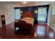 Spacious bedroom with ample natural light, hardwood floors, and a serene atmosphere at 5017 E 127Th Ave, Temple Terrace, FL 33617