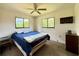 Comfortable bedroom featuring two windows offering natural light and neutral tones at 6285 52Nd N Ct, St Petersburg, FL 33709