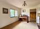 Cozy living room with natural light from a large window and a vintage piano at 6285 52Nd N Ct, St Petersburg, FL 33709