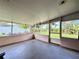 Enclosed screened porch providing a comfortable area for relaxing and enjoying the backyard view at 6285 52Nd N Ct, St Petersburg, FL 33709