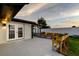 Outdoor patio with seating and an enclosed porch at 7031 Magnolia Valley Dr, New Port Richey, FL 34653