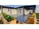 Inviting backyard featuring a patio, outdoor seating, flower boxes, and light paint at 7031 Magnolia Valley Dr, New Port Richey, FL 34653