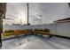 Spacious backyard featuring a patio, flower boxes, and a white fence at 7031 Magnolia Valley Dr, New Port Richey, FL 34653
