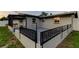Fenced backyard with a black metal fence at 7031 Magnolia Valley Dr, New Port Richey, FL 34653
