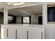 Breakfast bar with white cabinets and counter, perfect for casual dining and entertaining guests at 7031 Magnolia Valley Dr, New Port Richey, FL 34653