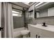 Updated bathroom featuring modern fixtures, a shower-tub combo, and a sleek design at 7031 Magnolia Valley Dr, New Port Richey, FL 34653