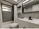 Updated bathroom featuring modern vanity, sleek fixtures, and a shower-tub combination at 7031 Magnolia Valley Dr, New Port Richey, FL 34653