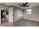 Comfortable bedroom features a ceiling fan, closet, and natural light, enhancing the room's spacious feel at 7031 Magnolia Valley Dr, New Port Richey, FL 34653