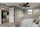 Cozy bedroom with a ceiling fan and a view into the kitchen, offering a comfortable and connected space at 7031 Magnolia Valley Dr, New Port Richey, FL 34653