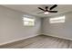Bedroom featuring wood floors and natural light at 7031 Magnolia Valley Dr, New Port Richey, FL 34653
