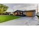 Inviting single-story home with a well-maintained lawn and spacious driveway at 7031 Magnolia Valley Dr, New Port Richey, FL 34653