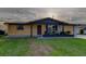 Charming single-story home with inviting curb appeal and modern wood accents at 7031 Magnolia Valley Dr, New Port Richey, FL 34653