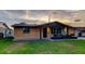Charming renovated home with updated front door and painted brick at 7031 Magnolia Valley Dr, New Port Richey, FL 34653