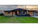 Charming single story home with wood and painted siding and a well maintained, green front yard at 7031 Magnolia Valley Dr, New Port Richey, FL 34653