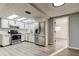 Modern kitchen with stainless steel appliances, white cabinets, and a bright, inviting atmosphere at 7031 Magnolia Valley Dr, New Port Richey, FL 34653