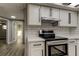 Updated kitchen featuring new appliances, subway tile backsplash, and ample cabinet space at 7031 Magnolia Valley Dr, New Port Richey, FL 34653