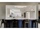 Bright, updated kitchen featuring a breakfast bar, modern lighting, and stainless steel appliances at 7031 Magnolia Valley Dr, New Port Richey, FL 34653