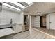 Updated kitchen featuring stainless steel appliances, a sliding barn door and a skylight at 7031 Magnolia Valley Dr, New Port Richey, FL 34653