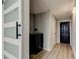 Laundry room with a modern washer and dryer setup, complemented by stylish door designs at 7031 Magnolia Valley Dr, New Port Richey, FL 34653