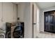 Practical laundry area with washer and dryer connections, and access to additional storage space at 7031 Magnolia Valley Dr, New Port Richey, FL 34653