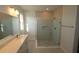 Modern bathroom featuring a glass-enclosed shower and a sleek vanity with ample counter space at 719 Allora Ave, Nokomis, FL 34275