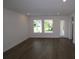 Bright living room with hardwood floors, recessed lighting, and large windows offering ample natural light at 719 Allora Ave, Nokomis, FL 34275