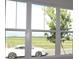 Bright home interior showcases a large window with clear views of neighborhood at 719 Allora Ave, Nokomis, FL 34275