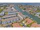 Beautiful waterfront community with canal access, docks, and well-manicured landscaping from an aerial view at 751 Pinellas Bayway S # 104, St Petersburg, FL 33715