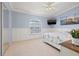 Bright bedroom with an abundance of natural light, beachy decor and television at 751 Pinellas Bayway S # 104, St Petersburg, FL 33715