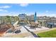 Waterfront dock featuring patio seating and boat lifts in a serene setting at 751 Pinellas Bayway S # 104, St Petersburg, FL 33715