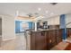 Bright kitchen featuring stone countertops, and connection to dining and living areas at 751 Pinellas Bayway S # 104, St Petersburg, FL 33715
