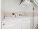Bright laundry room featuring white washer and dryer units at 751 Pinellas Bayway S # 104, St Petersburg, FL 33715