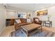 Inviting living room featuring a wet bar, leather furniture, and a ceiling fan at 751 Pinellas Bayway S # 104, St Petersburg, FL 33715