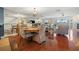 Open dining space flowing into a living area with fireplace and scenic views at 751 Pinellas Bayway S # 104, St Petersburg, FL 33715