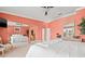 Spacious main bedroom with a luxurious bed, large mirror and view into the other rooms in the house at 751 Pinellas Bayway S # 104, St Petersburg, FL 33715