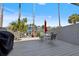 Outdoor patio space with a dining set, grill and beautiful scenery at 751 Pinellas Bayway S # 104, St Petersburg, FL 33715