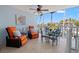 Relaxing patio with comfortable seating, ceiling fan, and scenic waterfront views at 751 Pinellas Bayway S # 104, St Petersburg, FL 33715