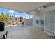 Outdoor patio area with dining set, spiral staircase, and views of the water at 751 Pinellas Bayway S # 104, St Petersburg, FL 33715