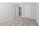 A bright bedroom with plush carpeting and white doors, providing a clean and inviting space at 7683 Deer Valley Circle, Tampa, FL 33635