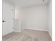 Empty bedroom features carpeted floor and white walls and baseboards at 7683 Deer Valley Circle, Tampa, FL 33635