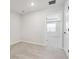 Carpeted bedroom with white walls, baseboards, and doorway leading to another room at 7683 Deer Valley Circle, Tampa, FL 33635