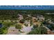 Aerial view of the neighborhood showcasing lush landscaping, and serene surroundings at 8604 Herons Cove Pl, Tampa, FL 33647